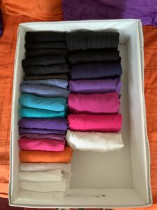 folded clothes in a box